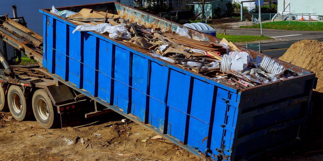 Roll off container full of construction debris