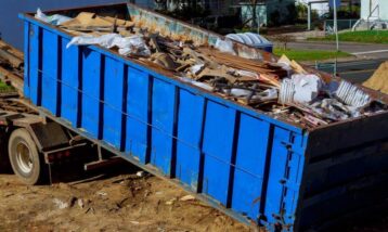 Roll-off dumpster with construction waste